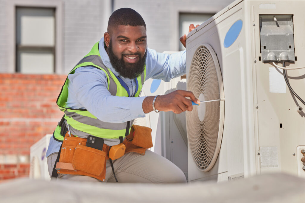Pelican Heating and Air technician servicing a residential air conditioning unit in Bellevue, WA