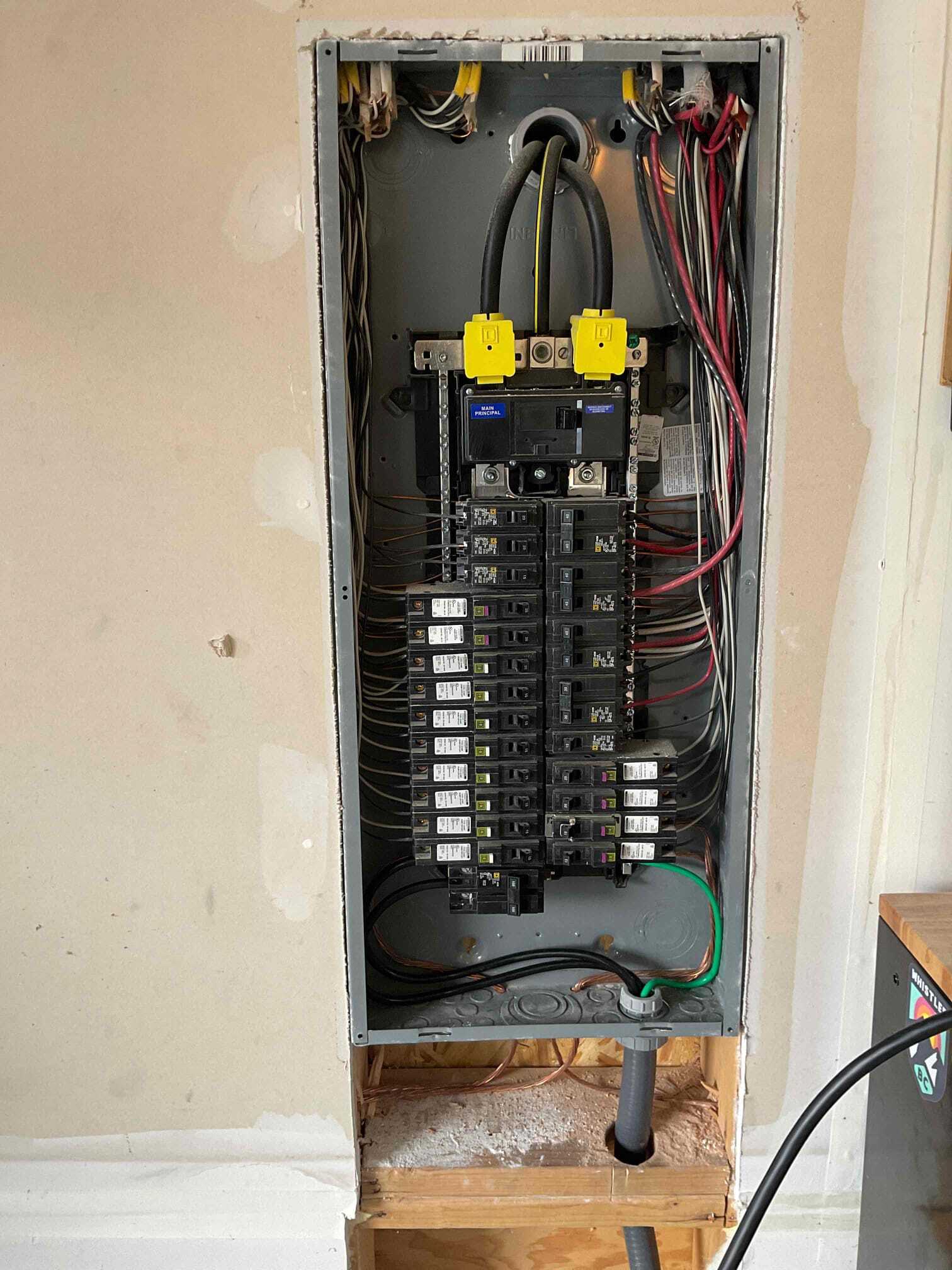 Technician from Pelican Heating & Air servicing air conditioner in Newcastle backyard