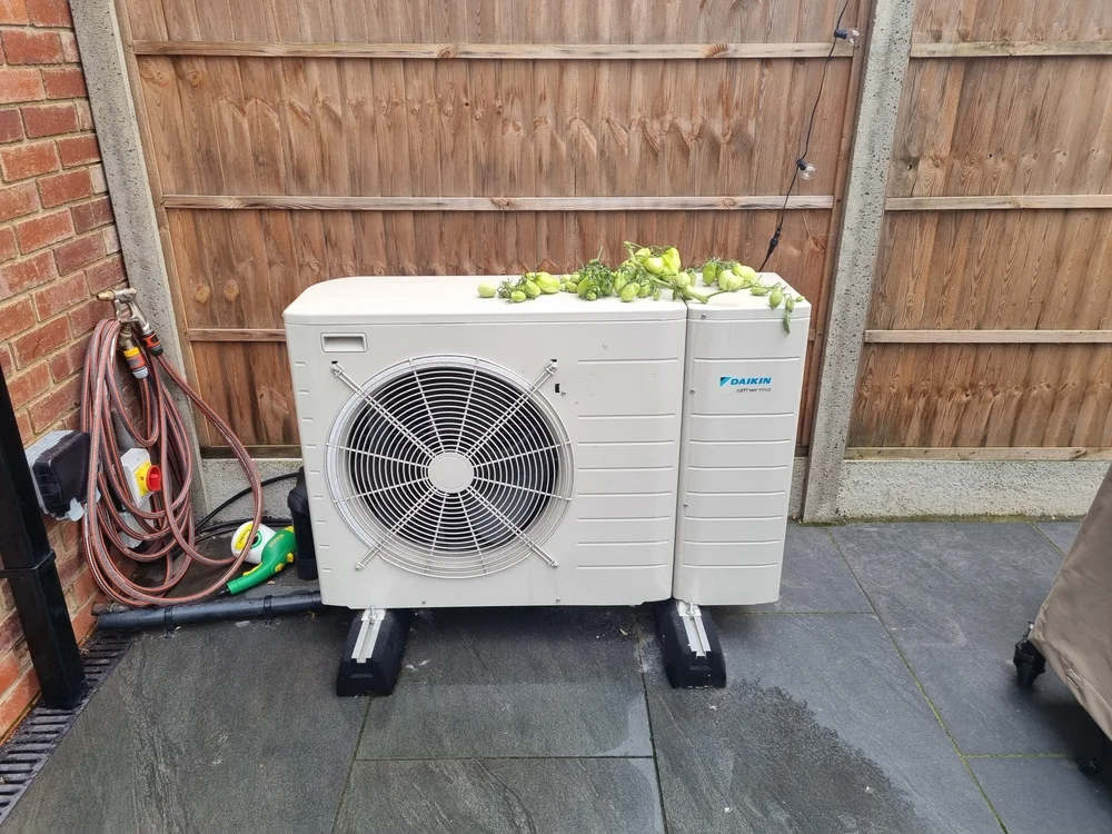 Pelican Heating & Air technician providing expert Daikin heat pump installation in Bellevue home, ensuring energy efficiency