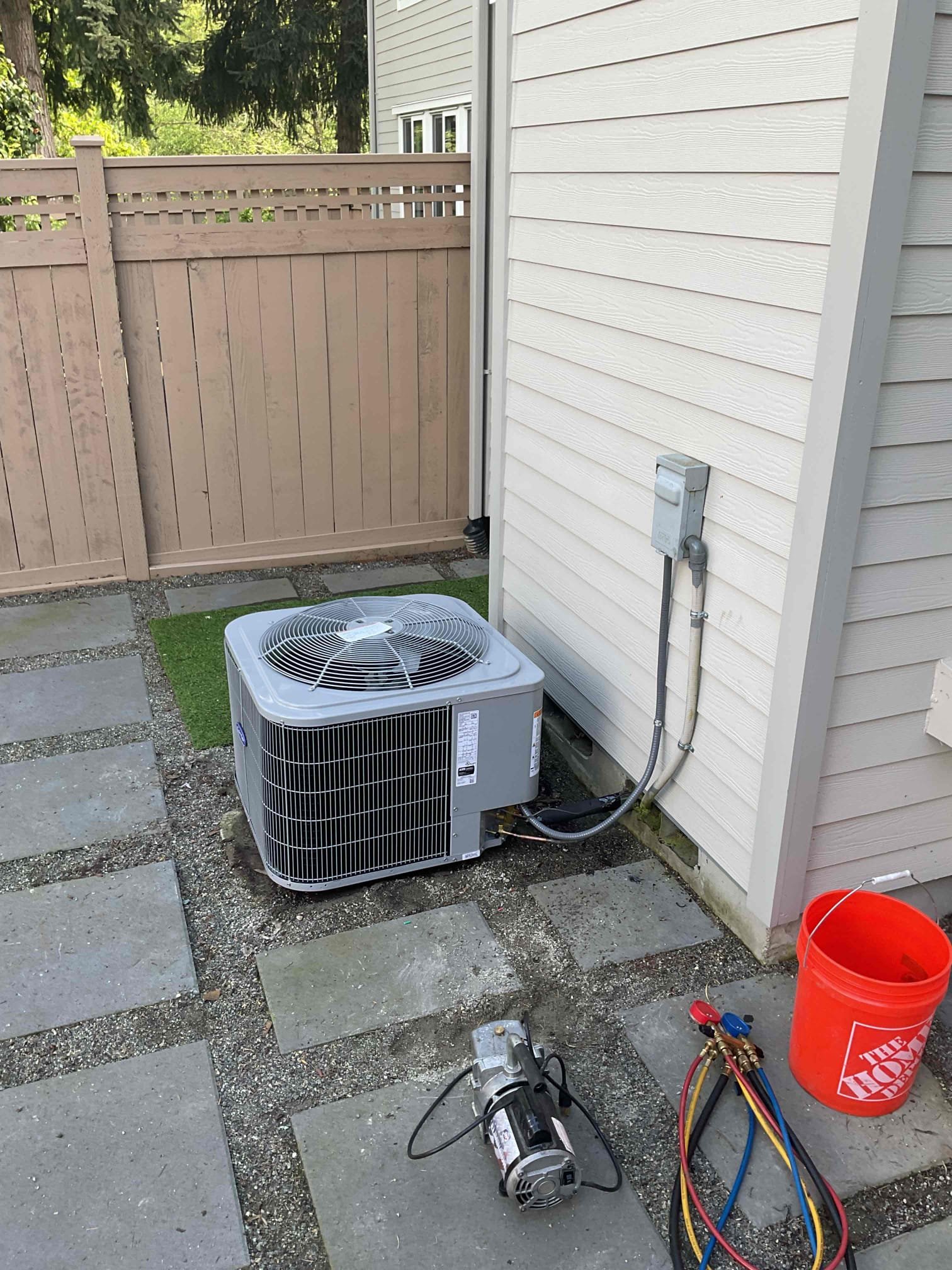 Pelican Heating & Air technician providing expert Daikin heat pump installation in Bellevue home, ensuring energy efficiency