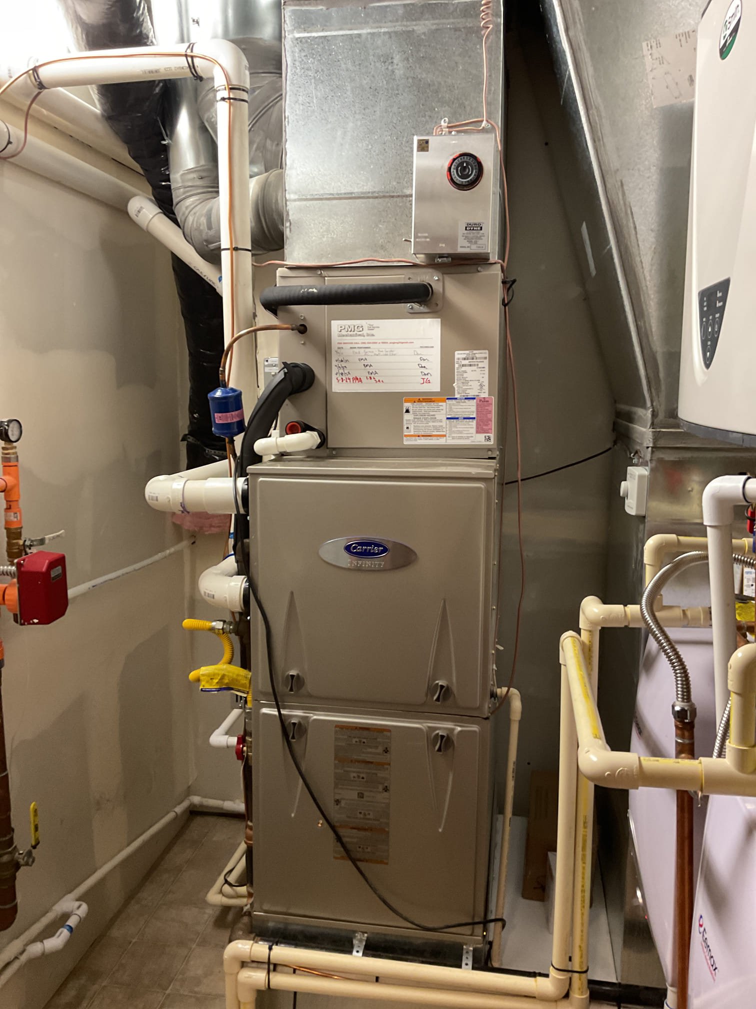 Redmond resident signing off on an AC repair estimate with HVAC tech