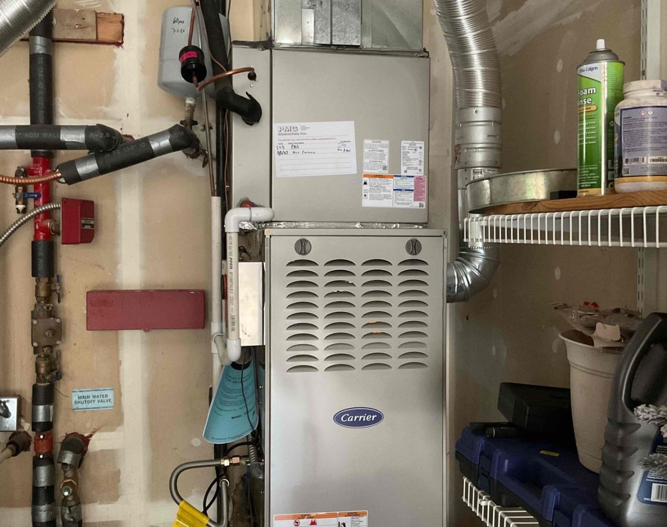 Technician performing Boiler Service in a Seattle, WA basement while testing pressure and circulation controls