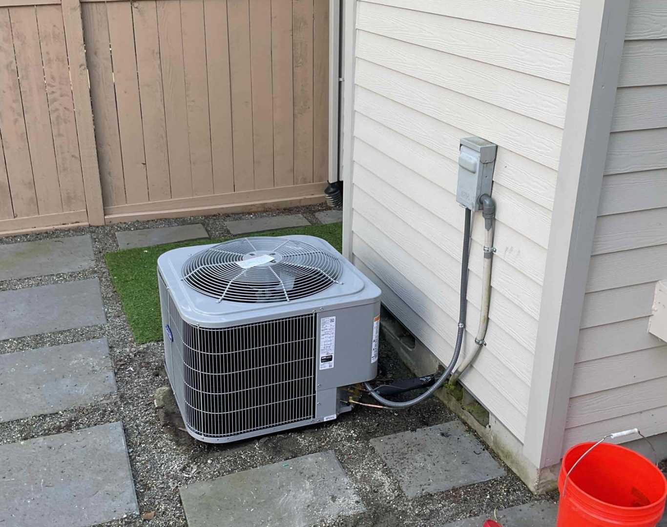 Pelican Heating & Air technician providing expert Daikin heat pump installation in Bellevue home, ensuring energy efficiency