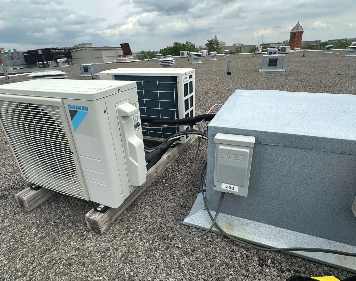 Expert technician from Pelican Heating & Air installing a Daikin heat pump in a Bellevue home, ensuring reliable climate control