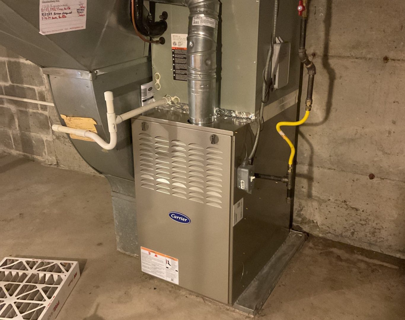 Redmond resident signing off on an AC repair estimate with HVAC tech