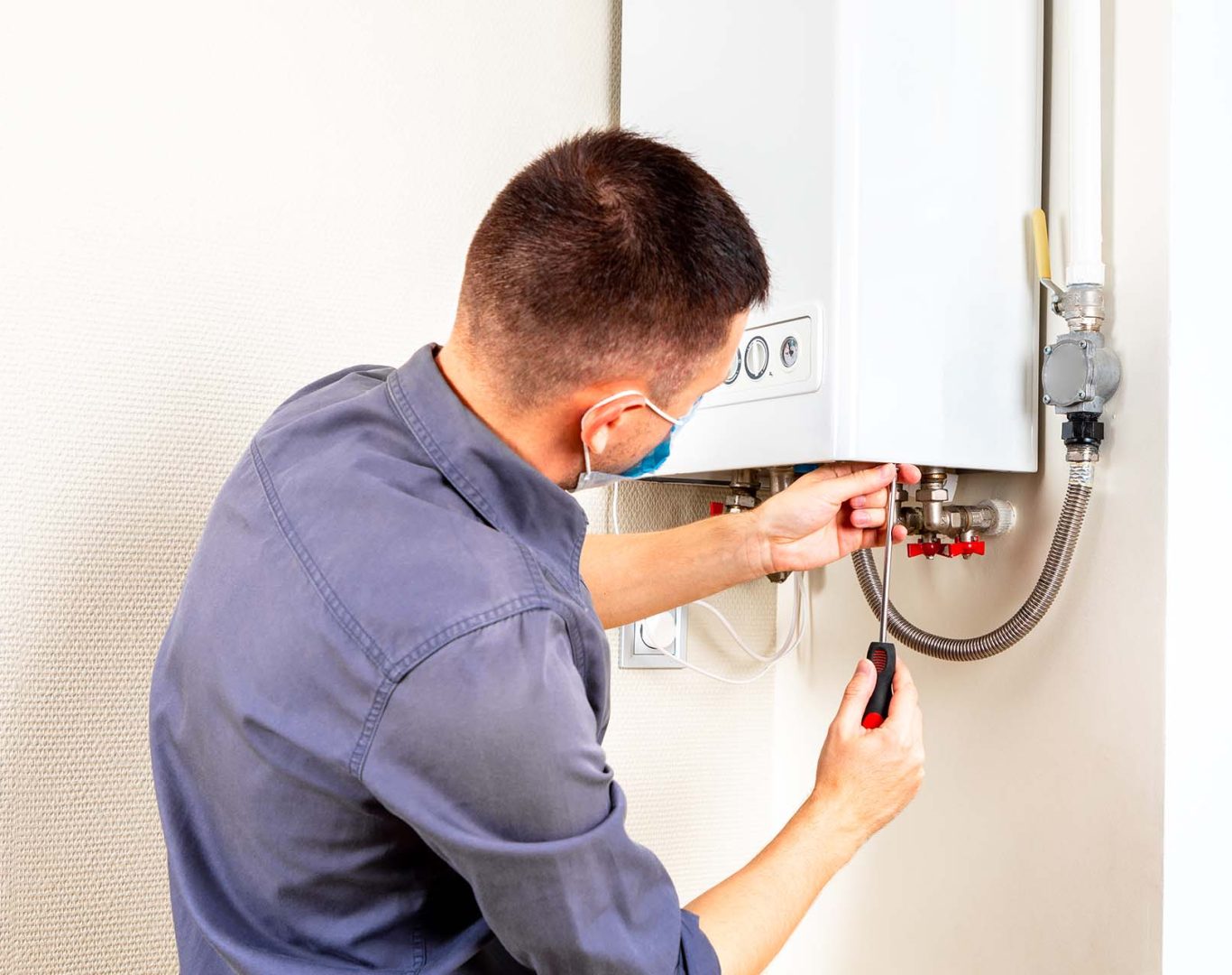 Expert technician conducting a thorough inspection and installation of a heating system in Mercer Island