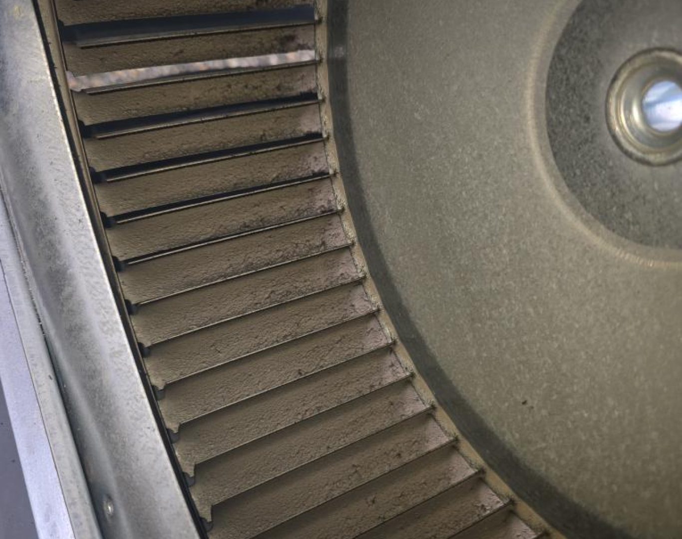 Pelican Heating & Air technician performing premium furnace cleaning in Redmond, WA home, ensuring efficiency and safety