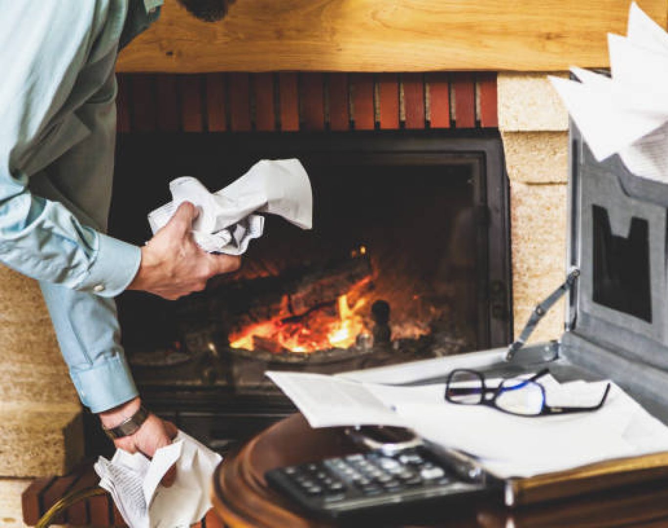 Specialist performing Gas Fireplace Service near a hearth in Newcastle, WA while testing vent and flame pattern