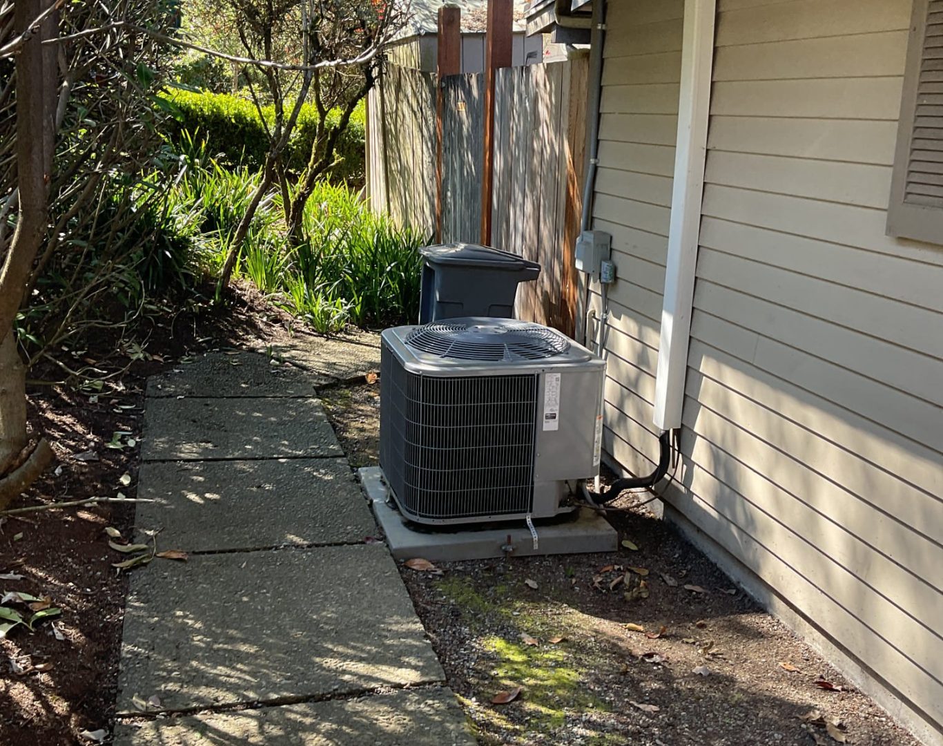 Redmond resident signing off on an AC repair estimate with HVAC tech