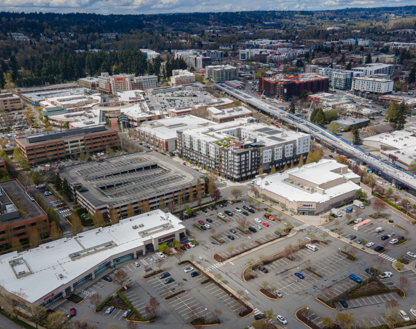 HVAC technician from Pelican Heating & Air servicing air conditioner in Redmond, WA