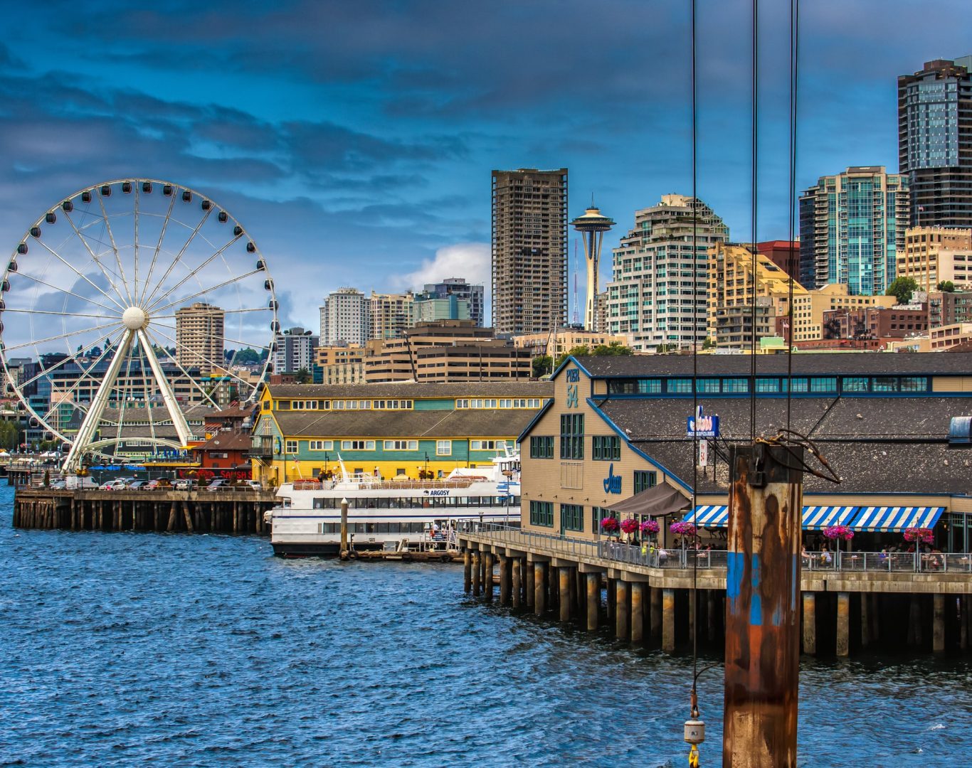 Pelican Heating & Air technician working on rooftop AC unit in downtown Seattle
