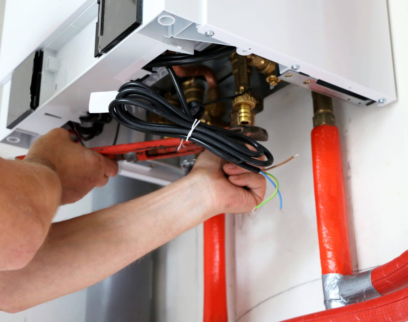 Expert technician from Pelican Heating & Air conducting a reliable heating installation in a Newcastle, WA home