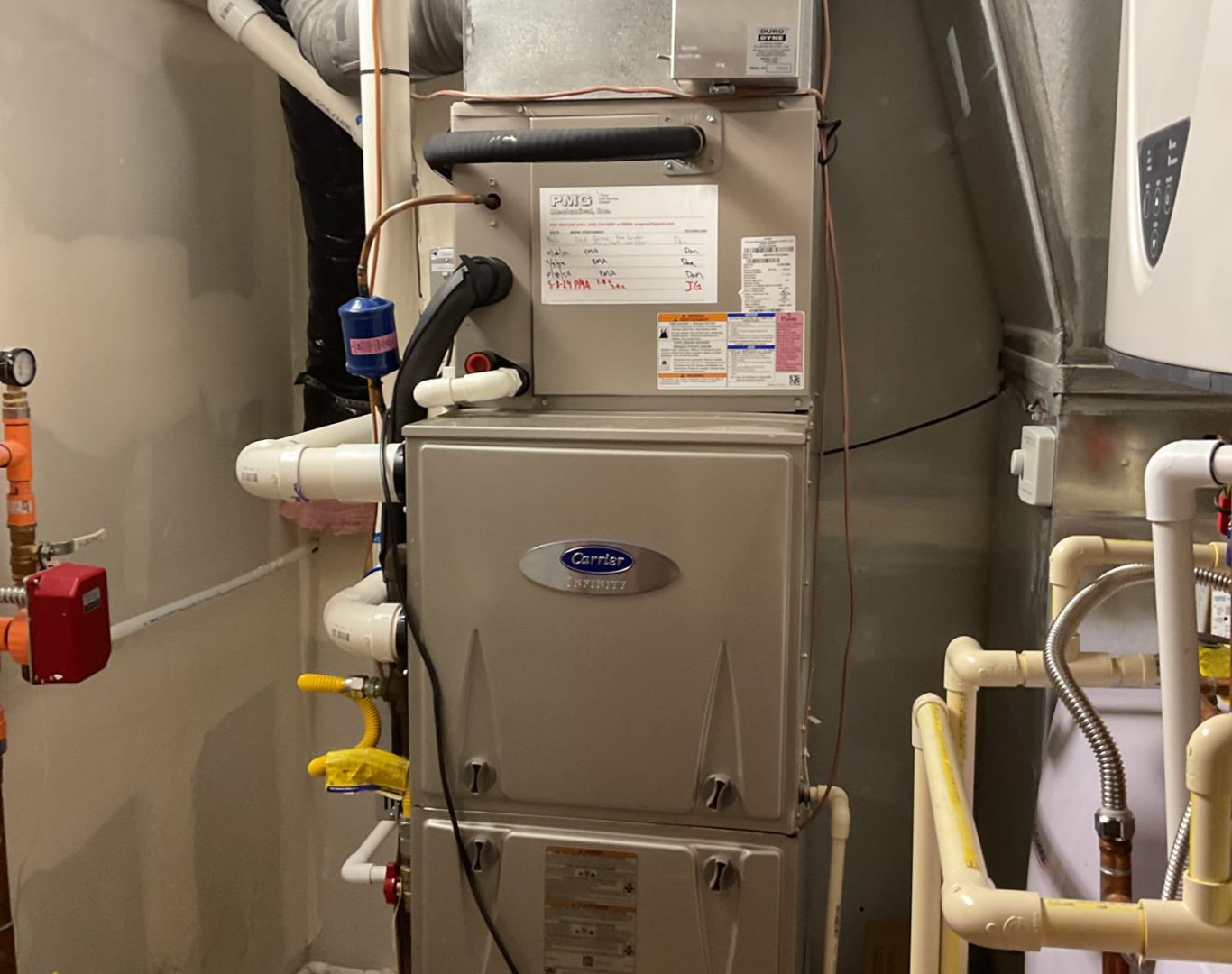 Redmond resident signing off on an AC repair estimate with HVAC tech