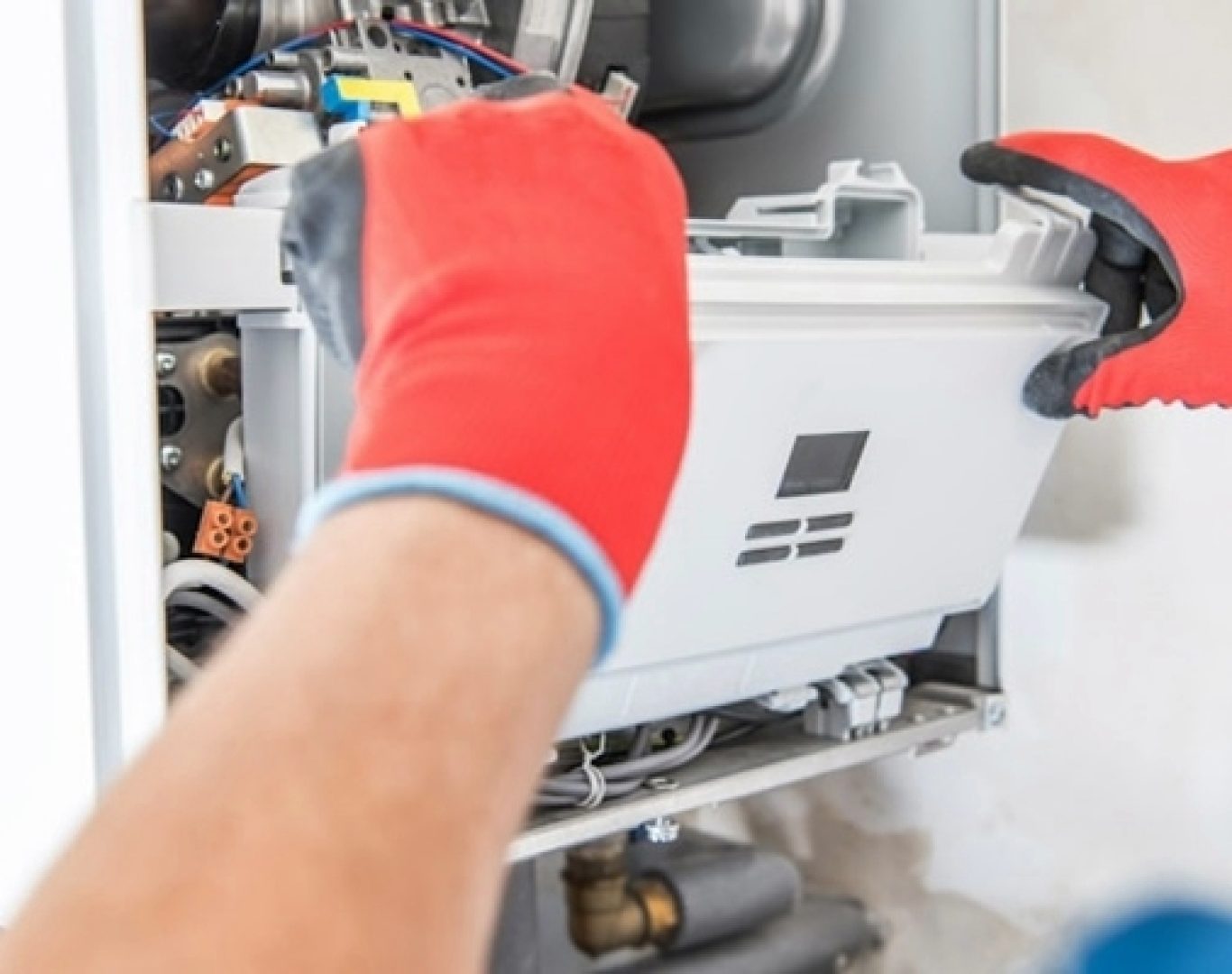 Pelican Heating & Air professional conducting thorough furnace cleaning in Newcastle, WA, promoting health and efficiency