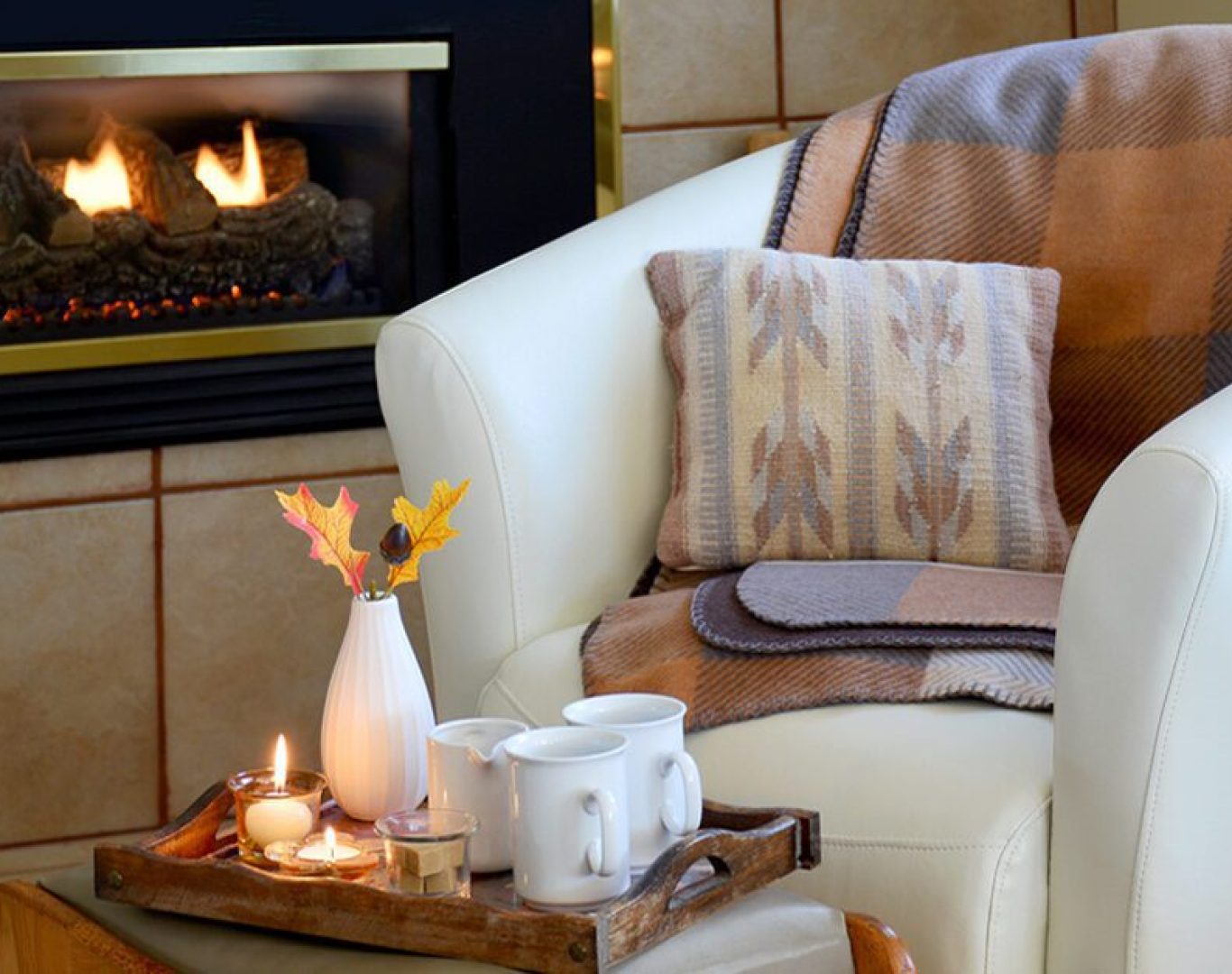 Technician repairing a gas fireplace in a Bellevue, WA family home before the winter heating season