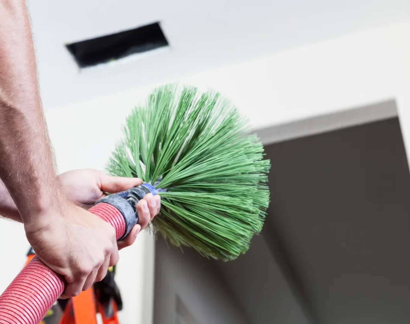 Skilled technician from Pelican Heating & Air conducting premium furnace cleaning, ensuring Redmond, WA homes stay warm and efficient