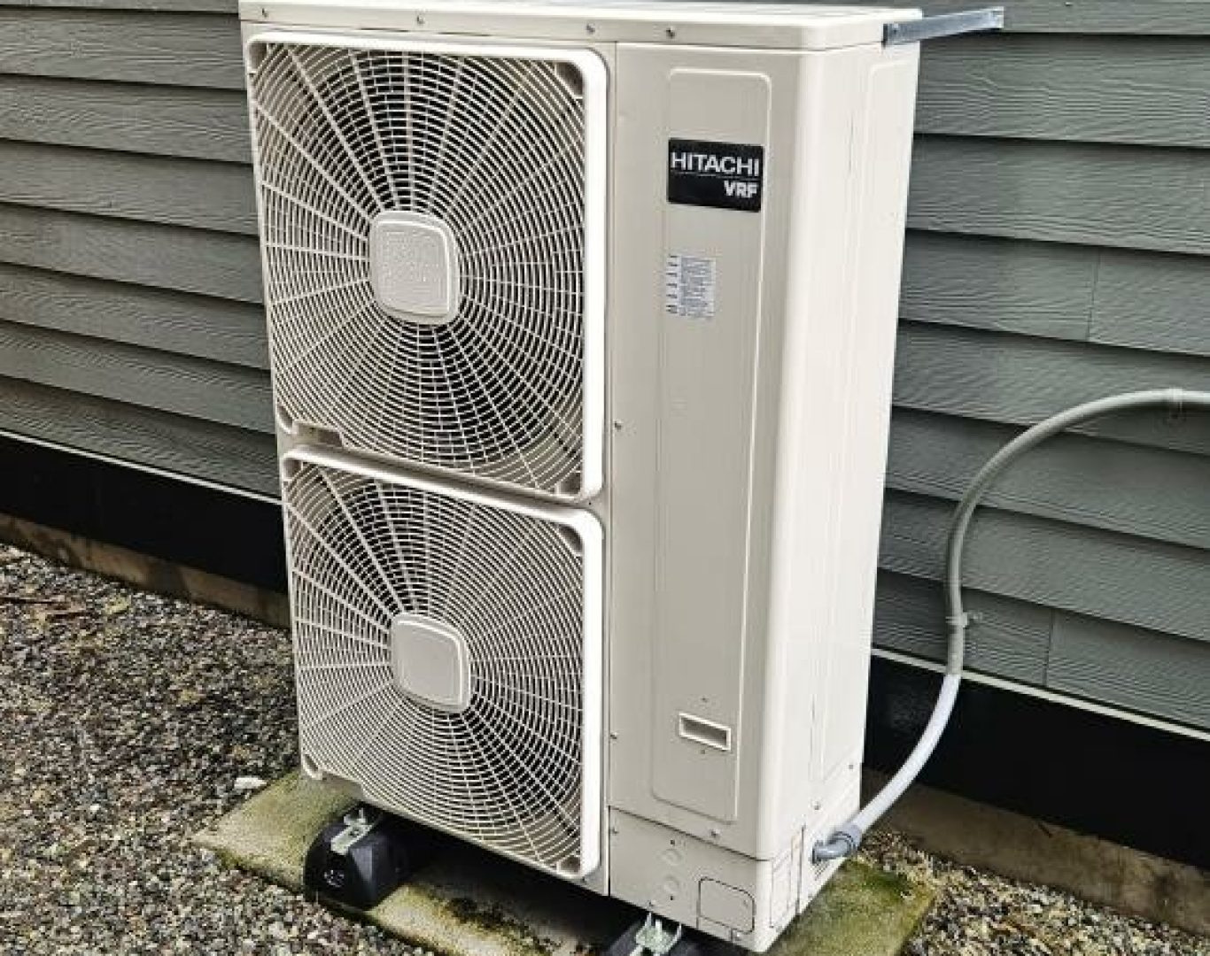 Pelican Heating and Air technician servicing a residential air conditioning unit in Bellevue, WA