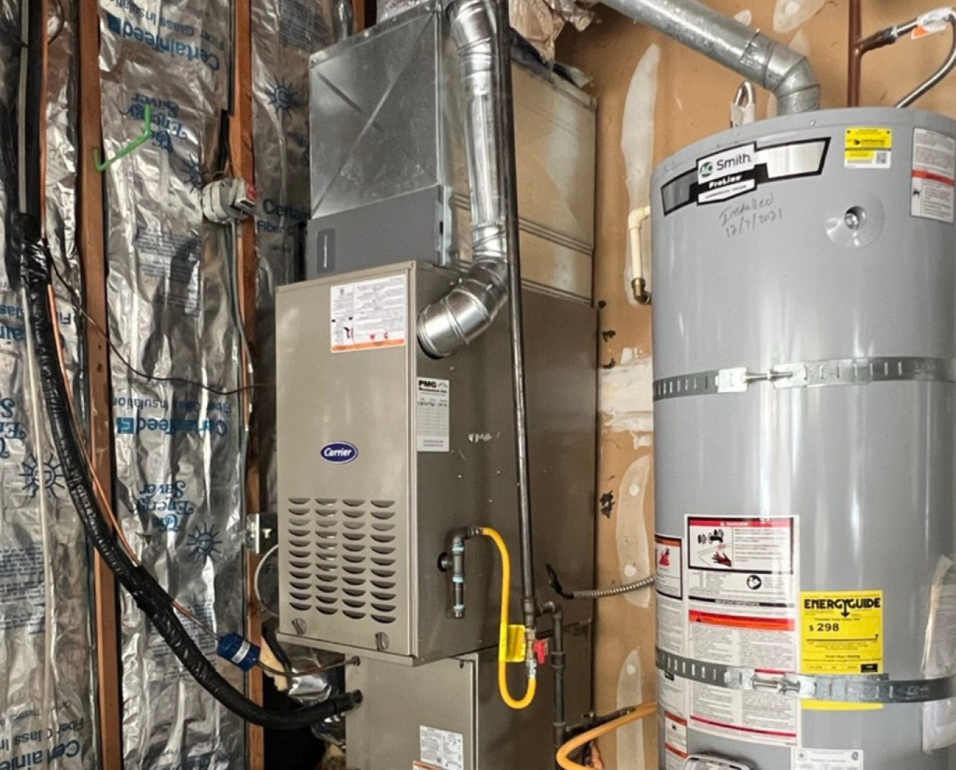 Pelican Heating & Air technician performing premium furnace cleaning in Redmond, WA home, ensuring efficiency and safety
