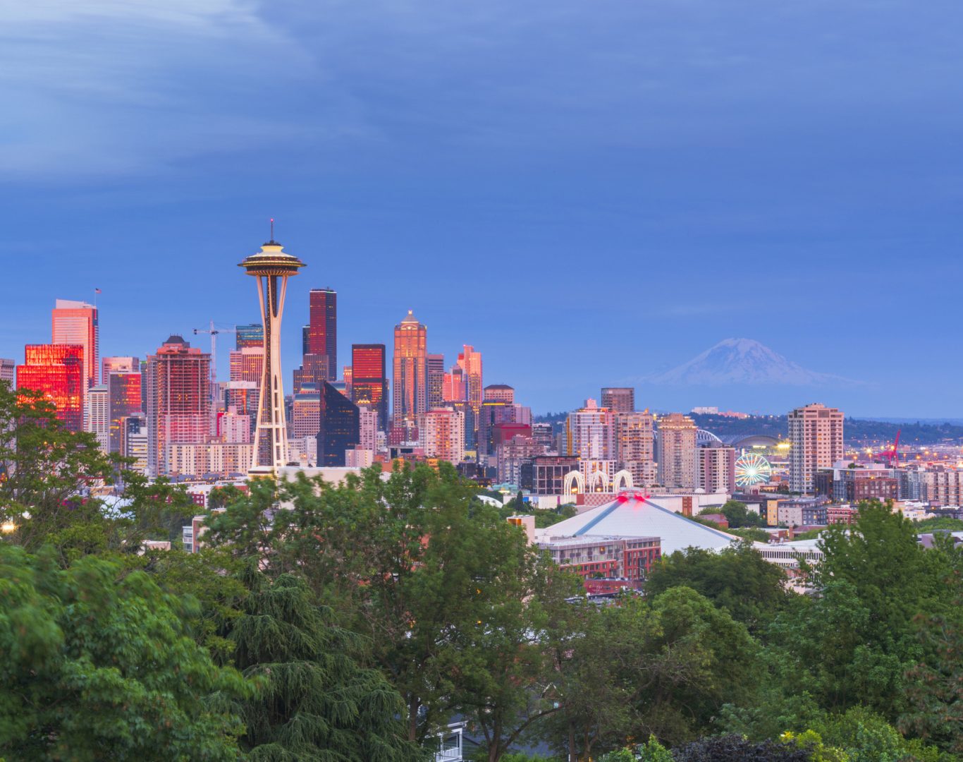 Pelican Heating & Air technician working on rooftop AC unit in downtown Seattle