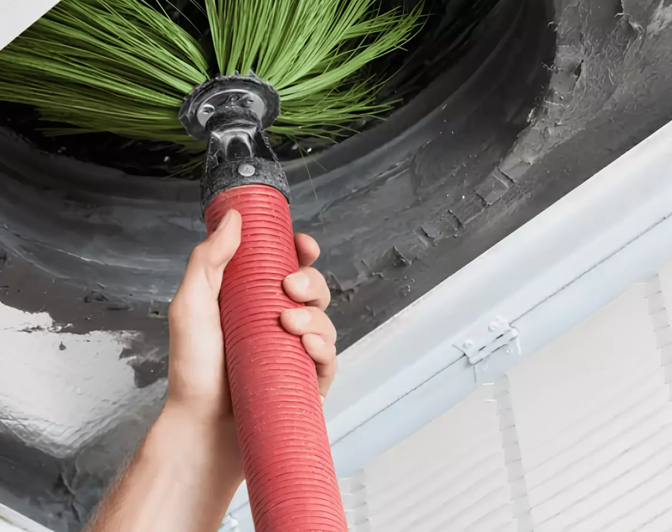 Pelican Heating & Air technician performing premium furnace cleaning in Redmond, WA home, ensuring efficiency and safety